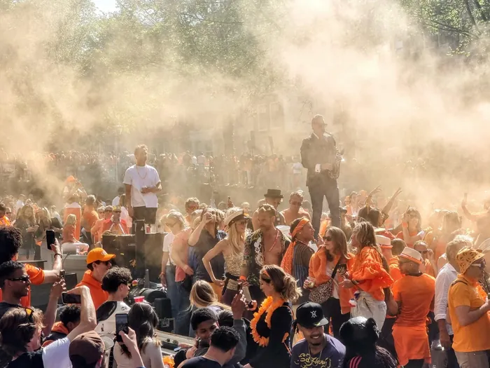 Crowd in orange celebrating King’s Day in Amsterdam